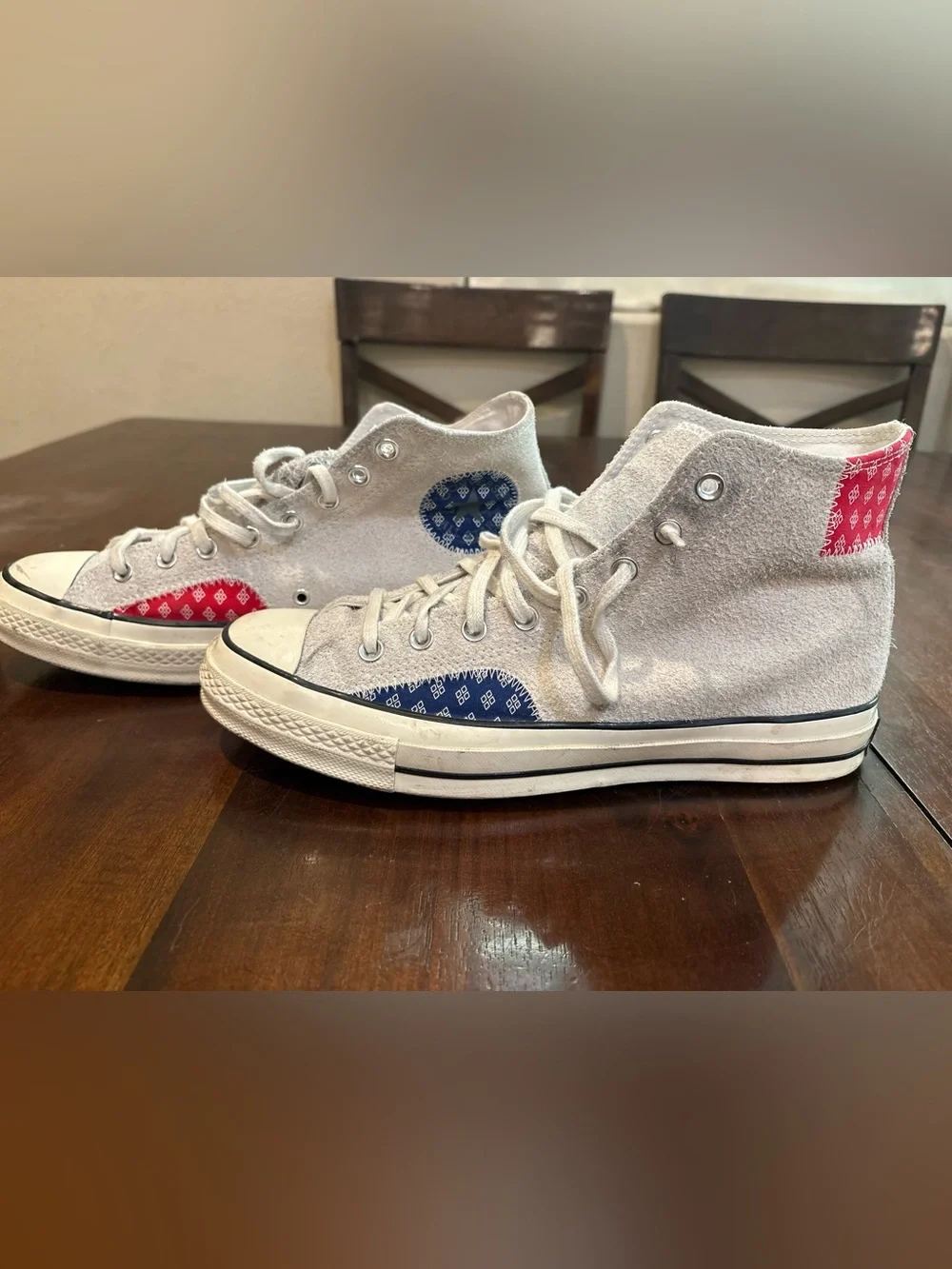 Converse Chuck Taylor’s White High Top Sneakers with Red and Blue Accents